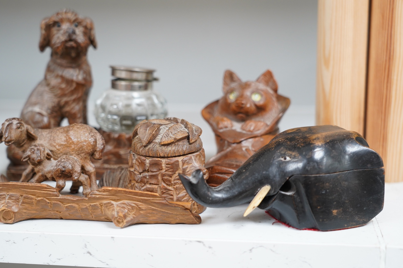 A collection of five carved wooden novelty animal inkwells, four black forest, tallest dog inkwell 15cm high. Condition - some small chips but fair